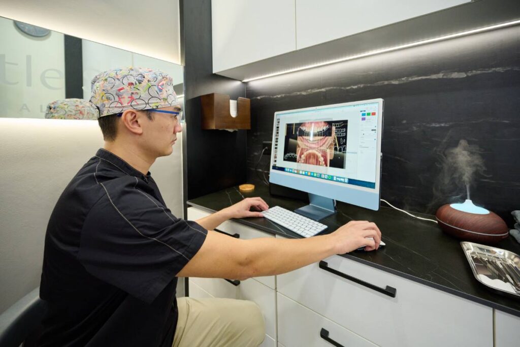 dr kelvin chua dentist researching dental issues